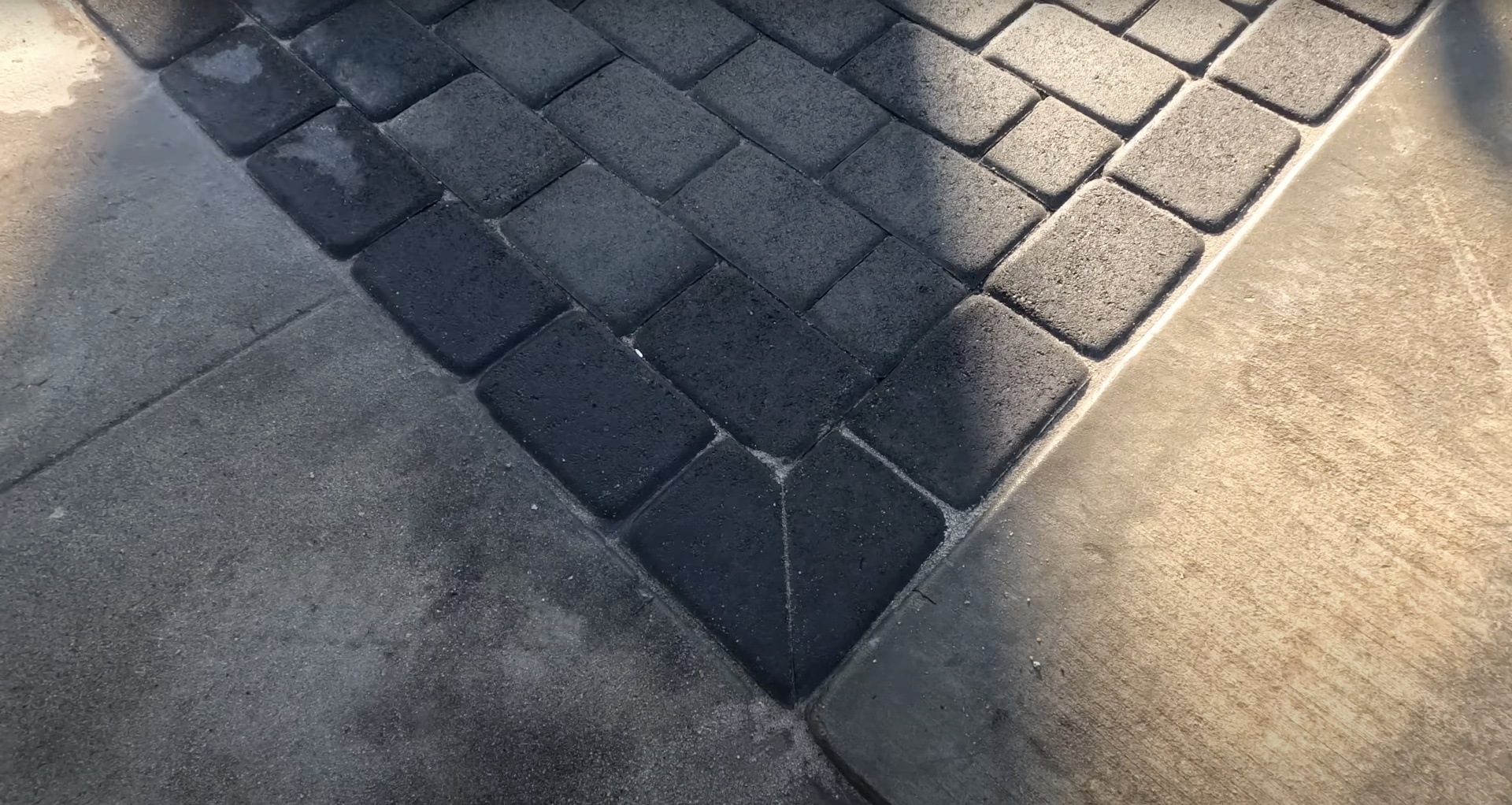 Gary Concrete - Detailed stamped concrete herringbone pattern work Detailed view of stamped concrete showing intricate herringbone pattern texture
